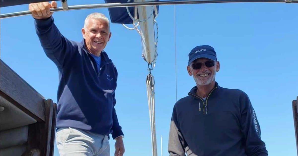 Two Westerly Owners Association members on deck under a clear blue sky